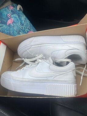 Nike All-White Platform Sneakers with Elevated Sole